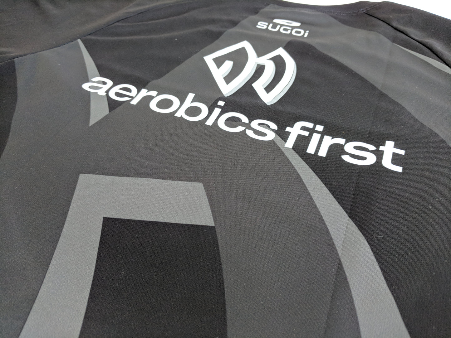 Aerobics First Sugoi Mens Big Logo Turbo Tee