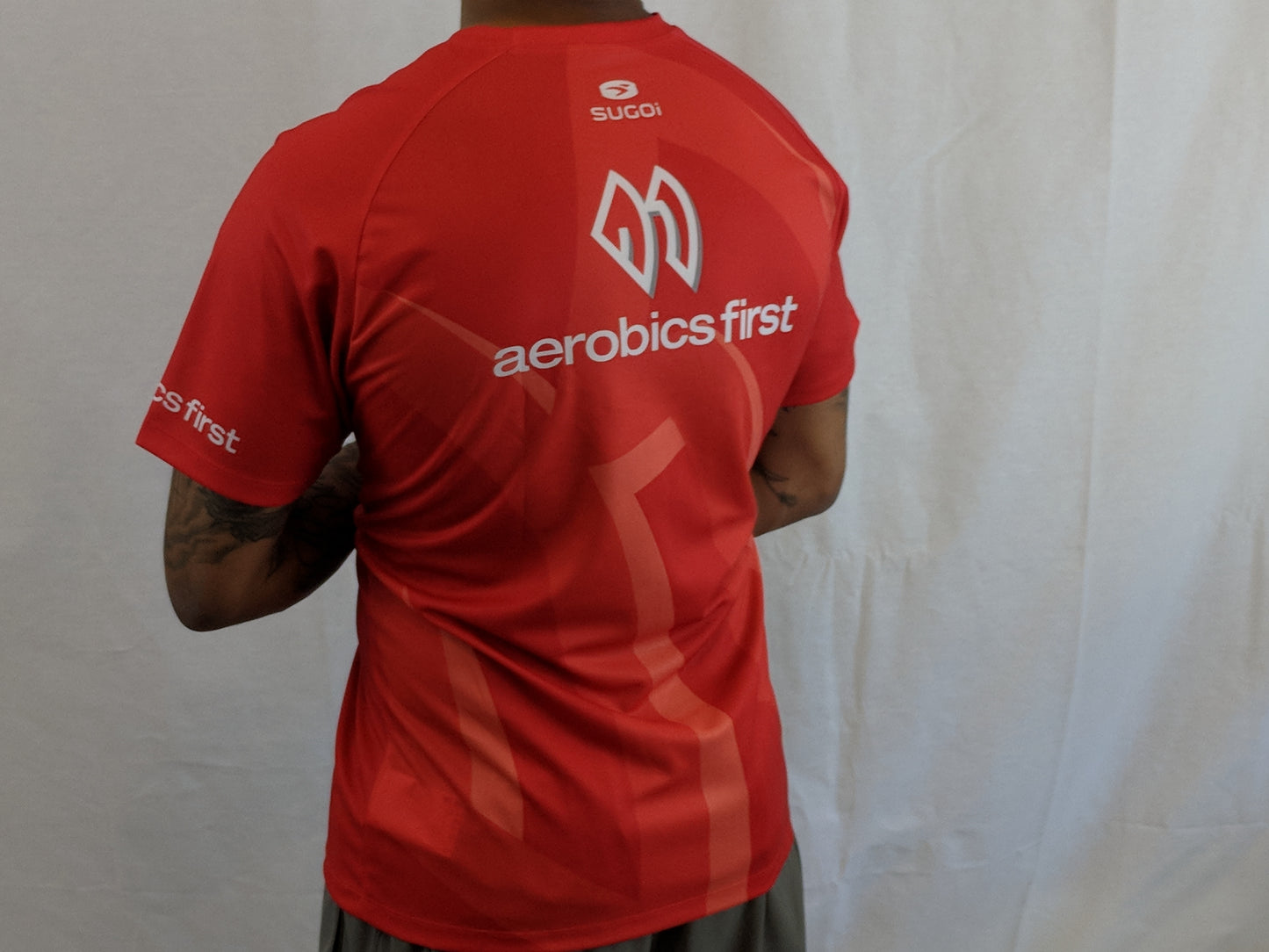 Aerobics First Sugoi Mens Big Logo Turbo Tee
