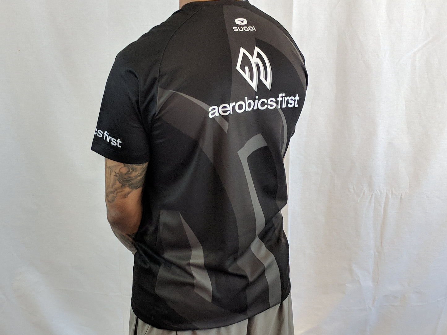 Aerobics First Sugoi Mens Big Logo Turbo Tee